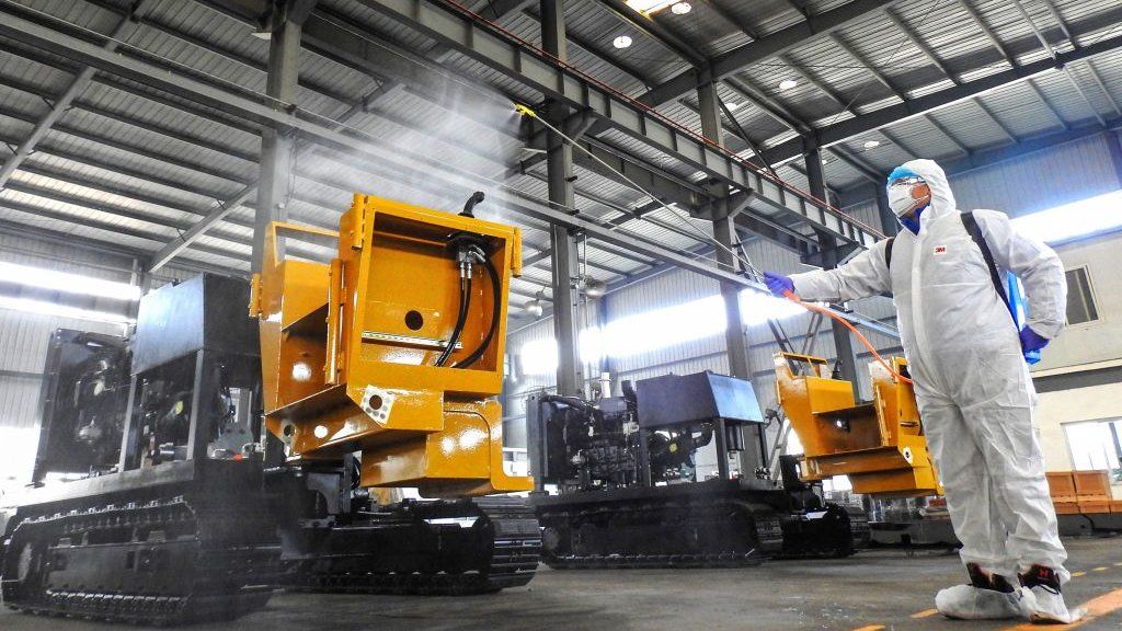 Aworker disinfecting machines before workers return to work from holidays at a factory in Lianyungang in China's eastern Jiangsu province.