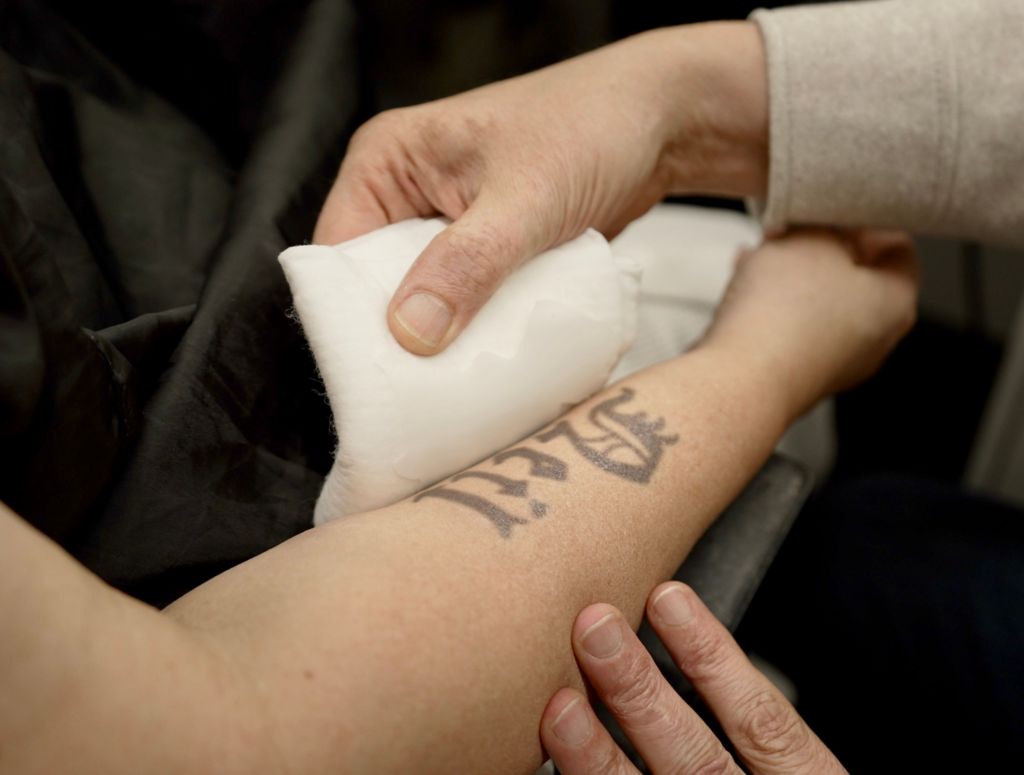 A close up of a fake Baby Neil tattoo on Ruth Jones's arm