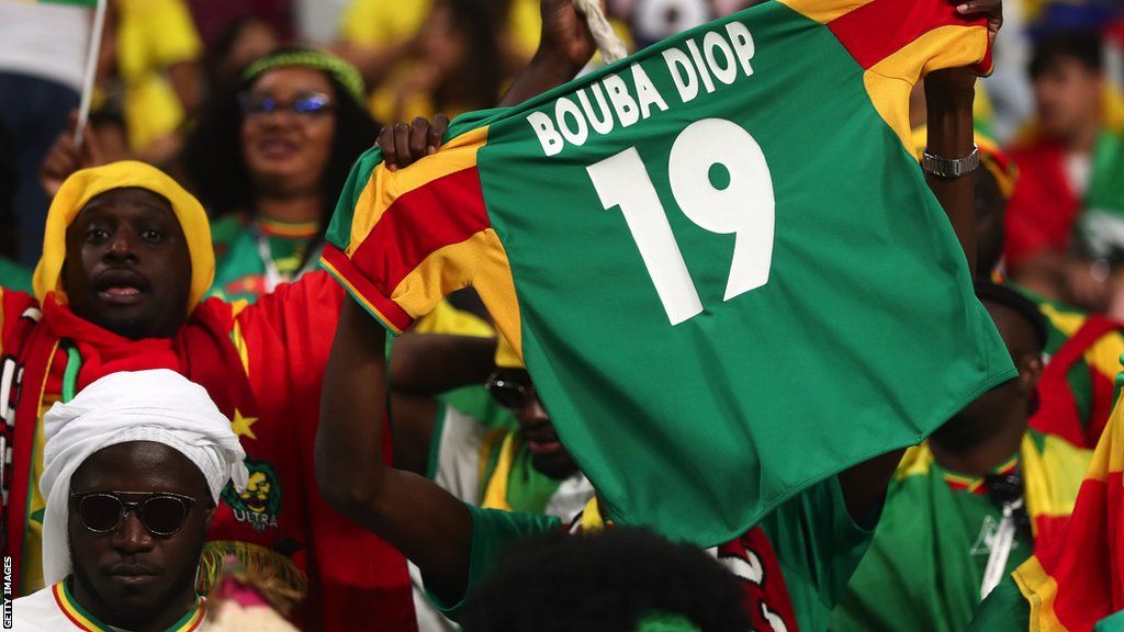 Senegal fans with a Papa Bouba Diop shirt