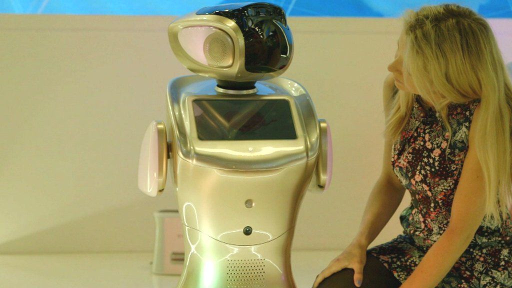 BBC Click's Jen Copestake (R) and a robot (L)