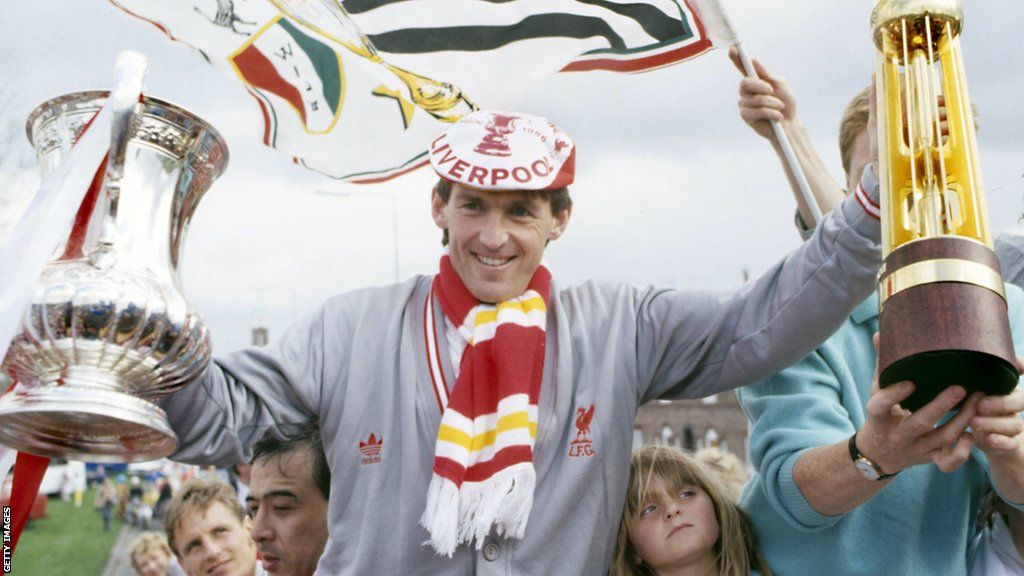 Liverpool player/manager Kenny Dalglish celebrates being the FA Cup and Division One champions