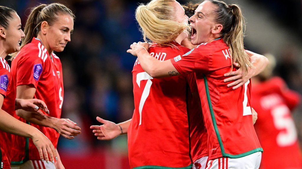 Wales celebrate Ceri Holland's first half equaliser