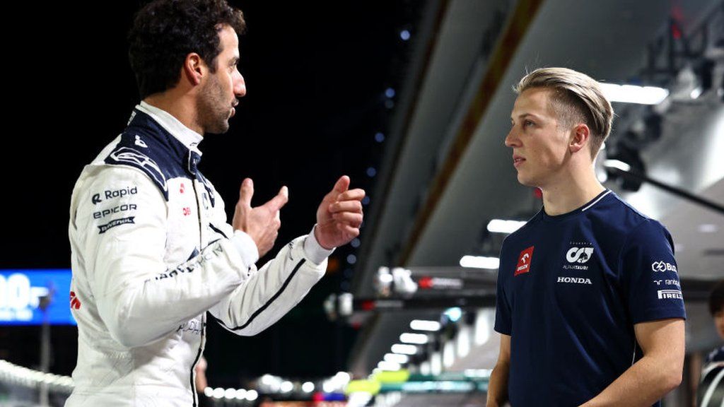 Daniel Ricciardo and Liam Lawson in conversation during the 2023 Las Vegas Grand Prix