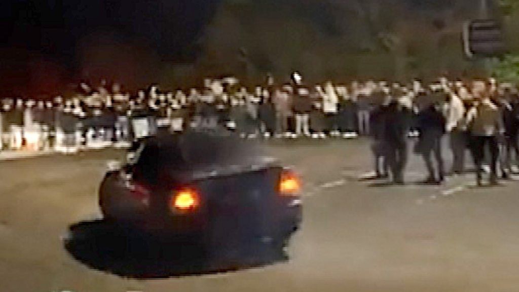Car performs stunts close to spectators at unauthorised car meet