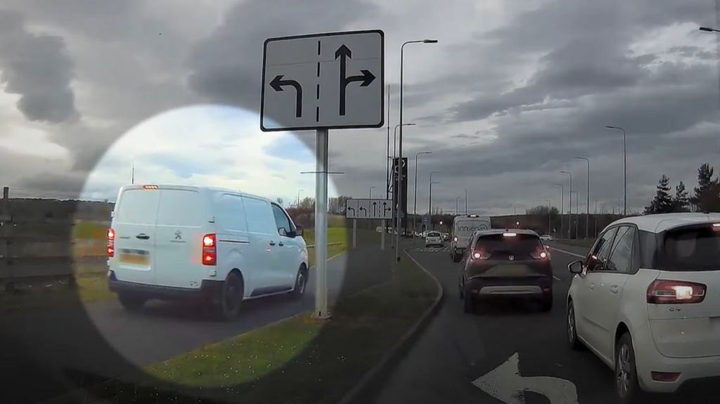 Van driving on a pavement