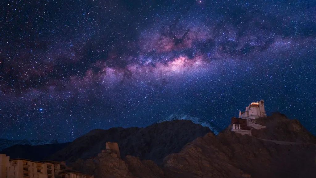 Extreme long exposure image showing milky way with Namgyal Tsemo Gompa, main buddhist monastery centre in Leh, Ladakh, India