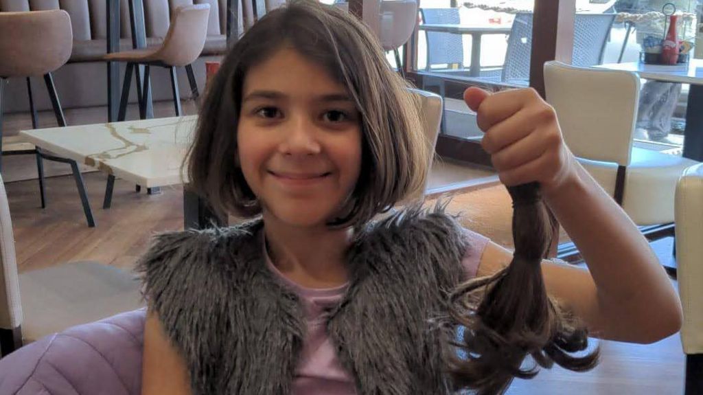 Ada Bicakci holding donated hair