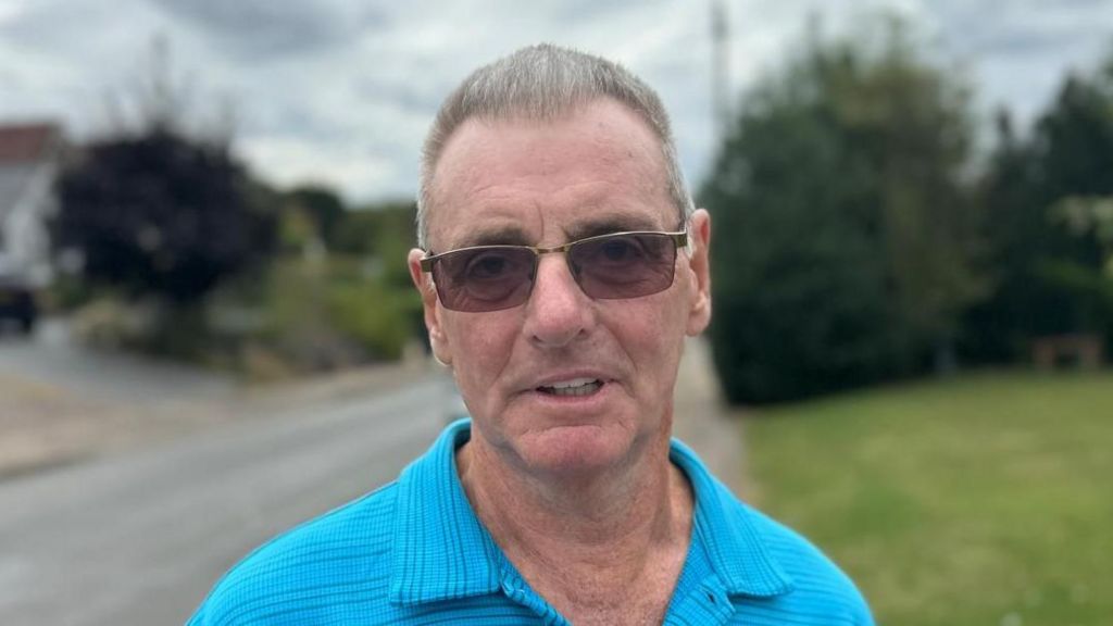 Mick Allen standing in a street in Great Easton