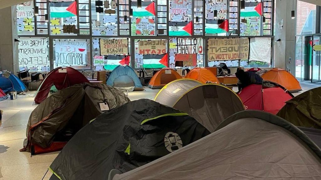 Students set up camp in LSE's atrium after the release of the Assets in Apartheid report