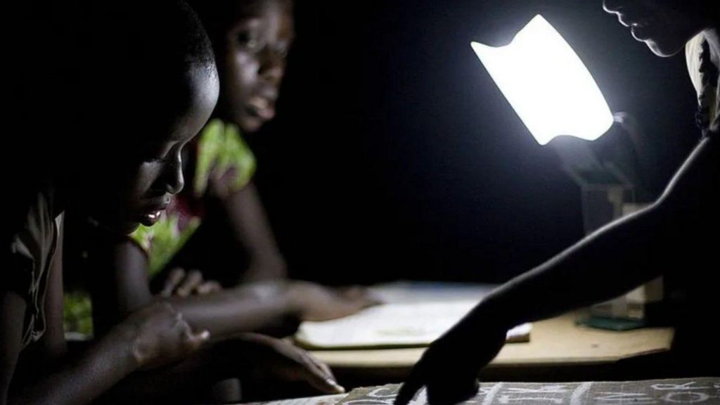 Children read using solar-charged lights 