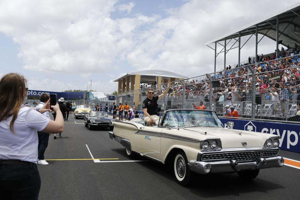 Haas driver Nico Hulkenberg sits in an open-top car during the drivers' parade before the 2023 Miami Grand Prix