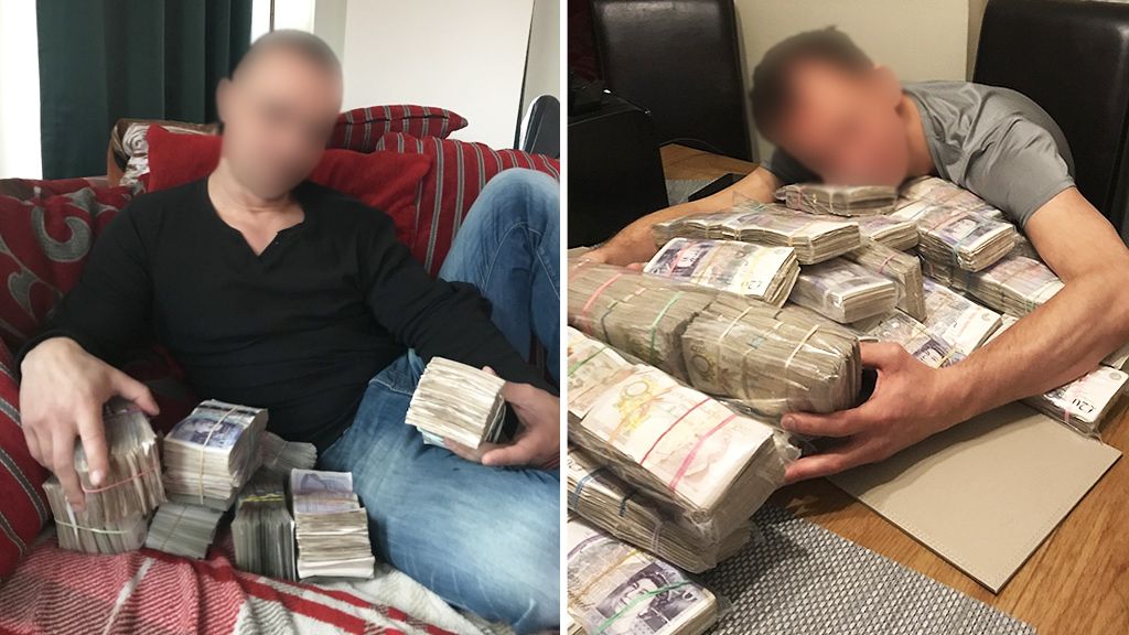 Two members of the gang, posing with blocks of bank notes