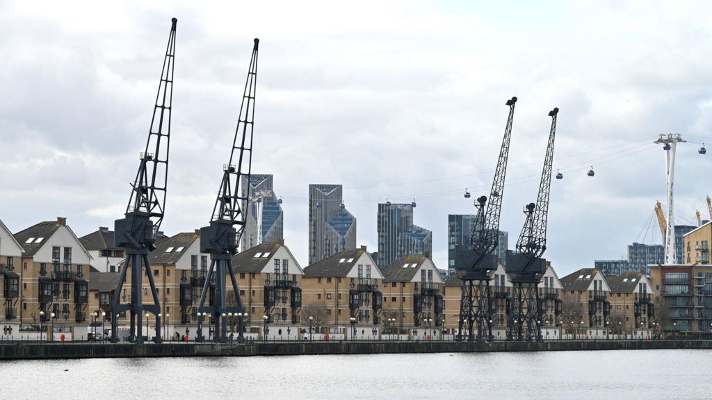 A general view of residential homes with Stothert and Pitt Cranes on the bank of Royal Victoria Dock and the IFS Cloud Cable Car.