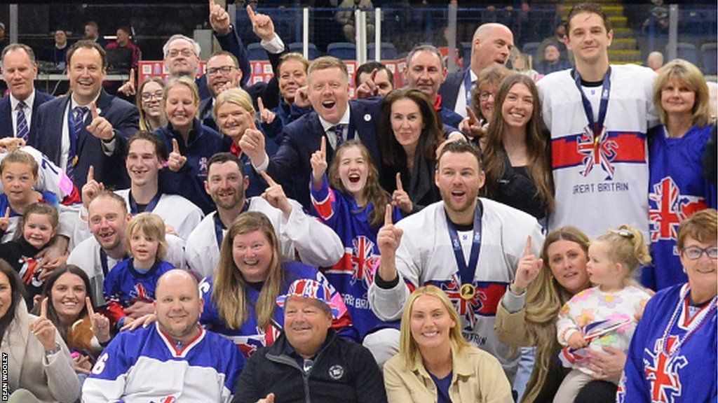 Pete Russell and wife Kate (centre) celebrate Team GB success at the 2023 IIHF World Championships