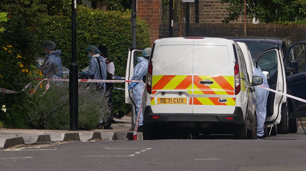 Police and forensic officers and at an address in Shepherd's Bush, west London, after human remains were found in two suitcases near the Clifton Suspension Bridge in Bristol