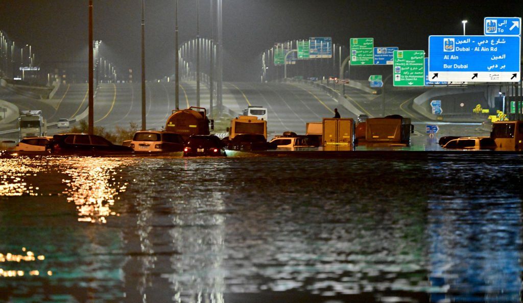 Vehicles are stranded in flood waters along a highway in Dubai