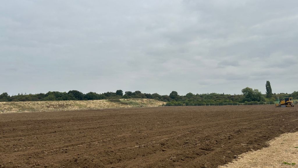 Cricket pitch being levelled