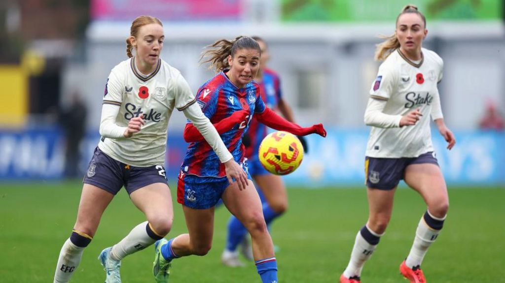 Sara Holmgaard and Indiah-Paige Riley battle for possession