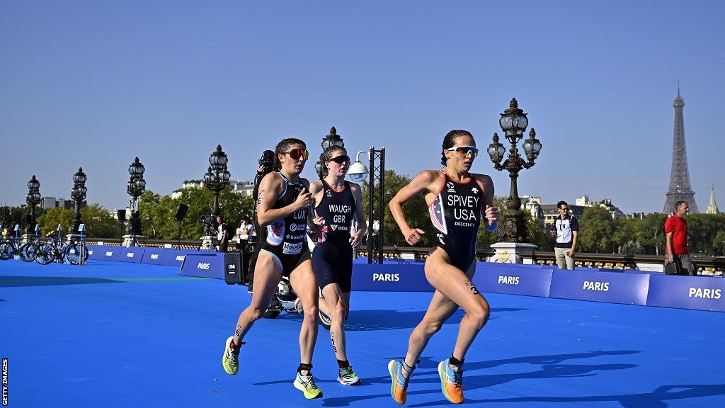 Kate Waugh, centre, competing in Paris in the World Triathlon series in August alongside Super League Triathlon rival Jeanne Lehair, left