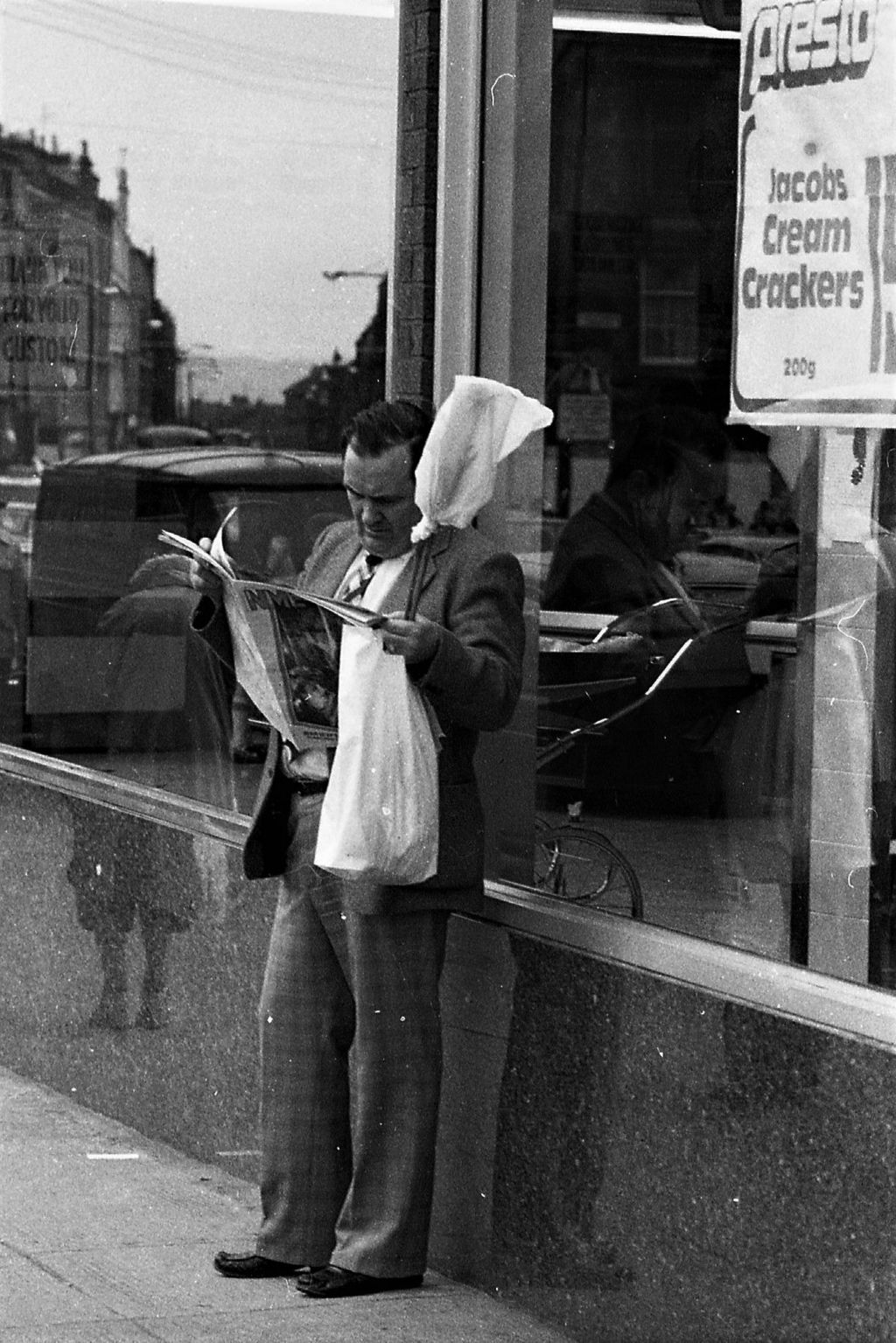 A music fan catches up with the latest edition of NME in Byres Road in 1981.