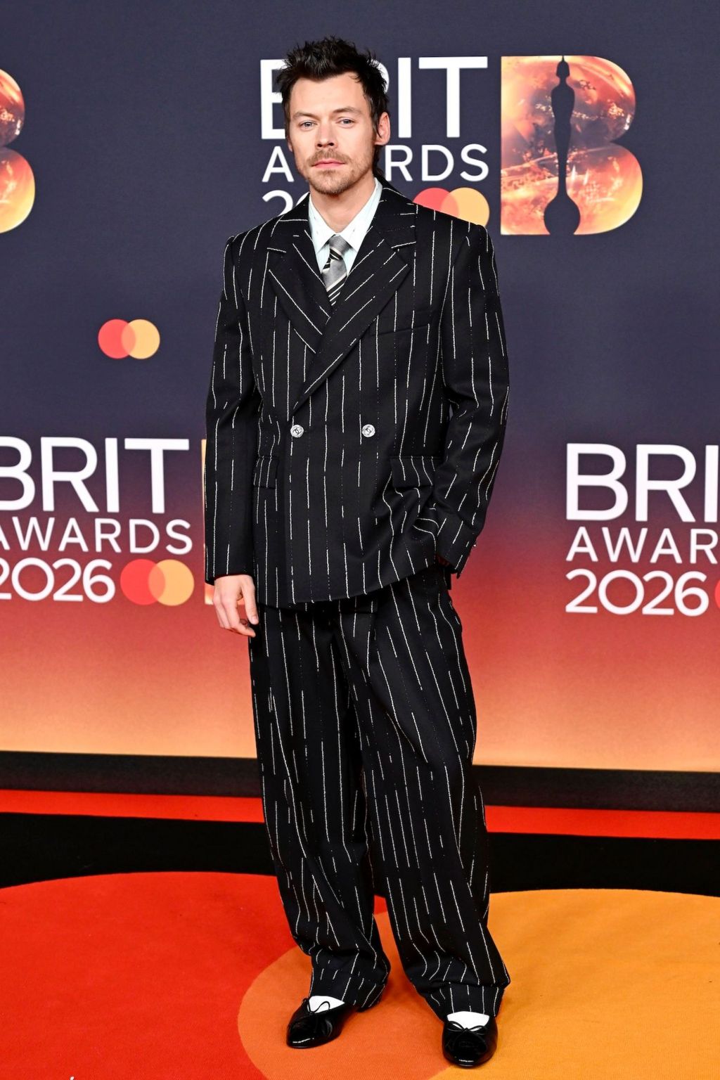 Harry Styles in an oversized pinstriped suit