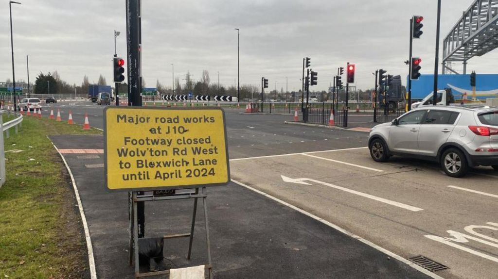 A sign warning of major road works until April 2024 at the M6's Junction 10