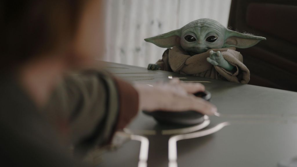 Grogu sitting at a table