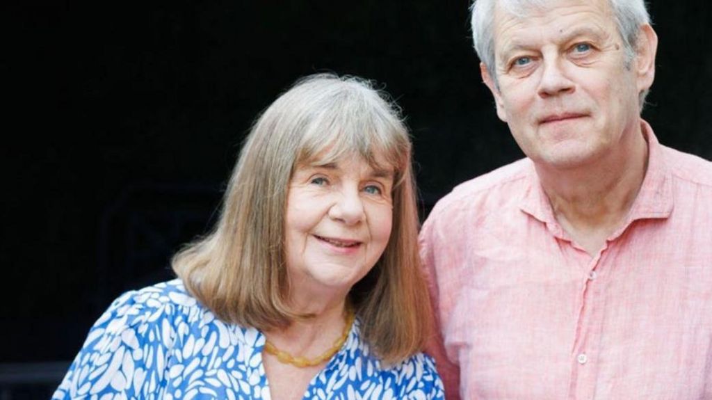 Julia Donaldson in a blue and white blouse with Axel Scheffler in a pink shirt