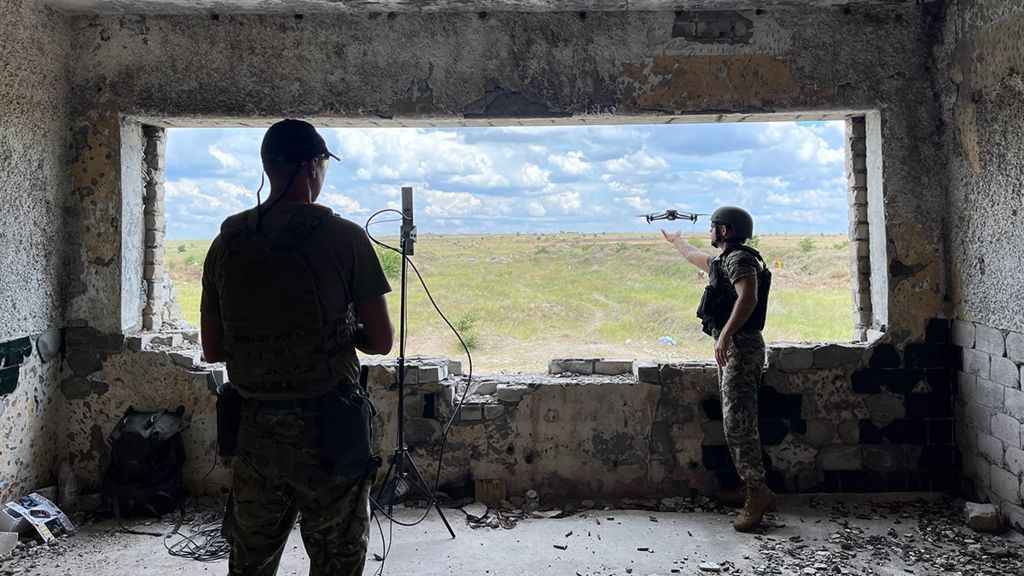 Two resistance fighters send off a drone