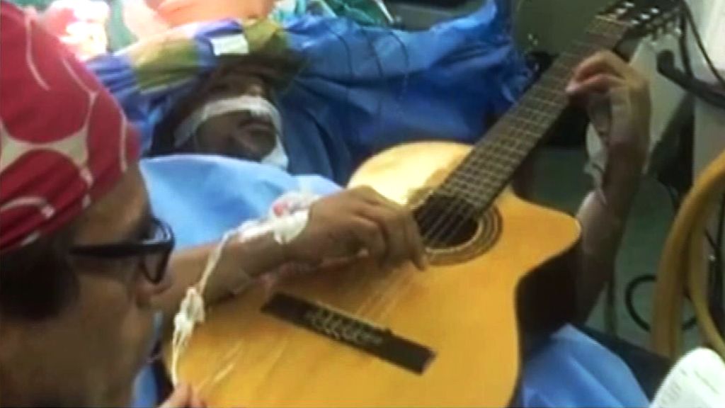 Jazz musician Musa Manzini was kept awake for part of his surgery to have a tumour removed.