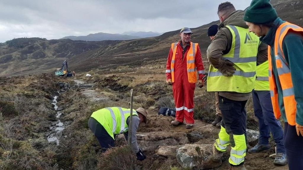 Some members of the group are repairing the badly-eroded path at Ben Vrackie
