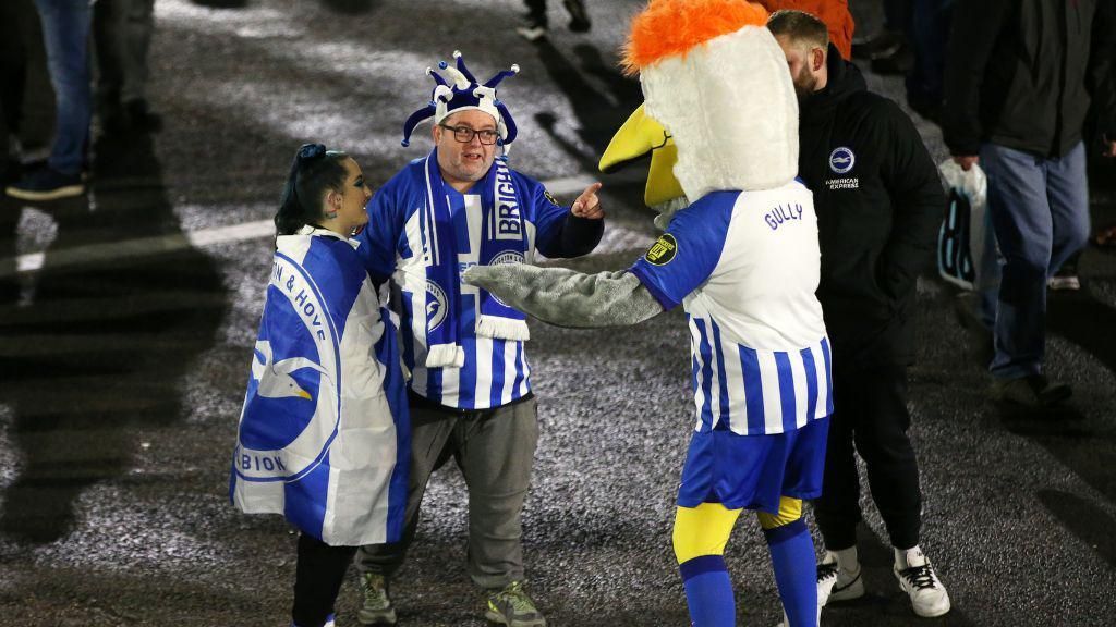 Albion fans with the Brighton mascot 