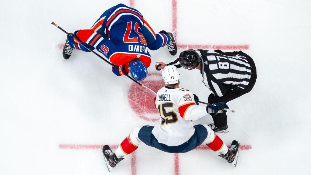 Connor McDavid, 97, of the Edmonton Oilers takes a face-off against Anton Lundell #15 of the Florida Panthers in Game Six of the 2024 Stanley Cup Final at Rogers Place on June 21, 2024, in Edmonton, Alberta, Canada