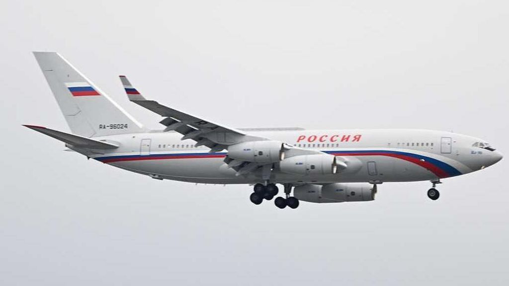 A white plane with the legend Rossiya arrives in Alaska in August