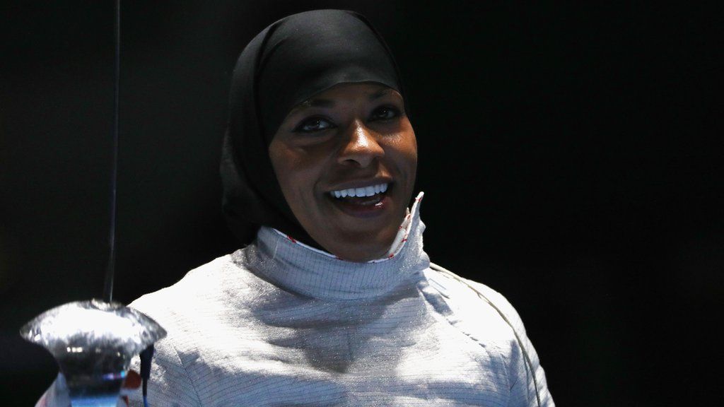United States athlete Ibtihaj Muhammad competing in fencing while wearing a hijab