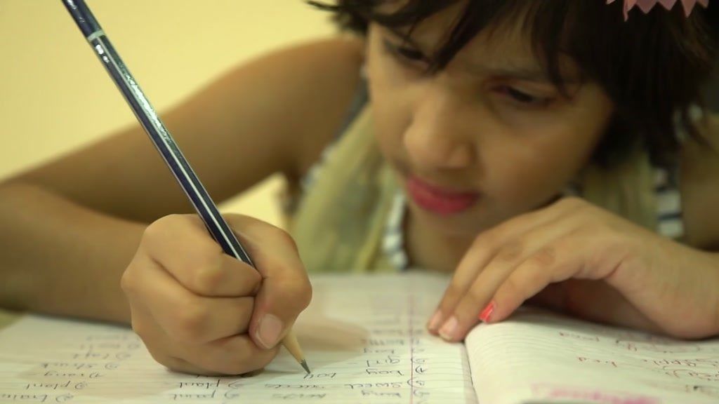 A child studying in India