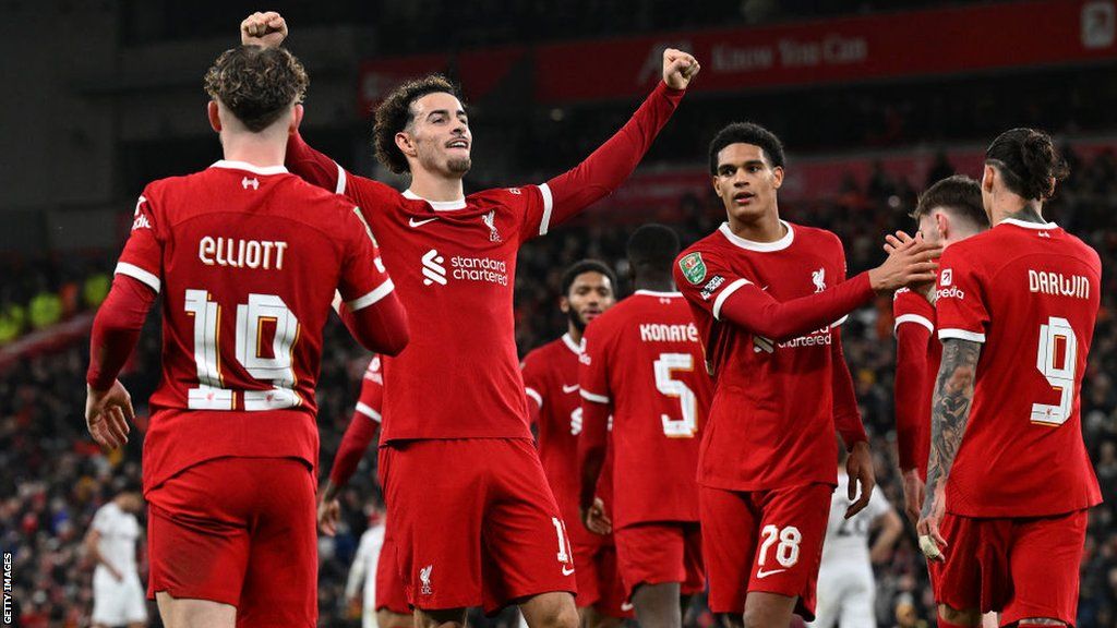 Liverpool players celebrate the win against West Ham