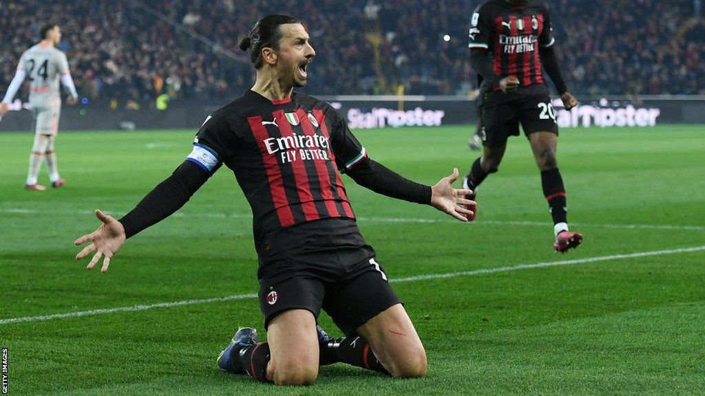Zlatan Ibrahimovic of AC Milan celebrates after scoring the team's first goal from a penalty kick during the Serie A match between Udinese Calcio and AC Milan