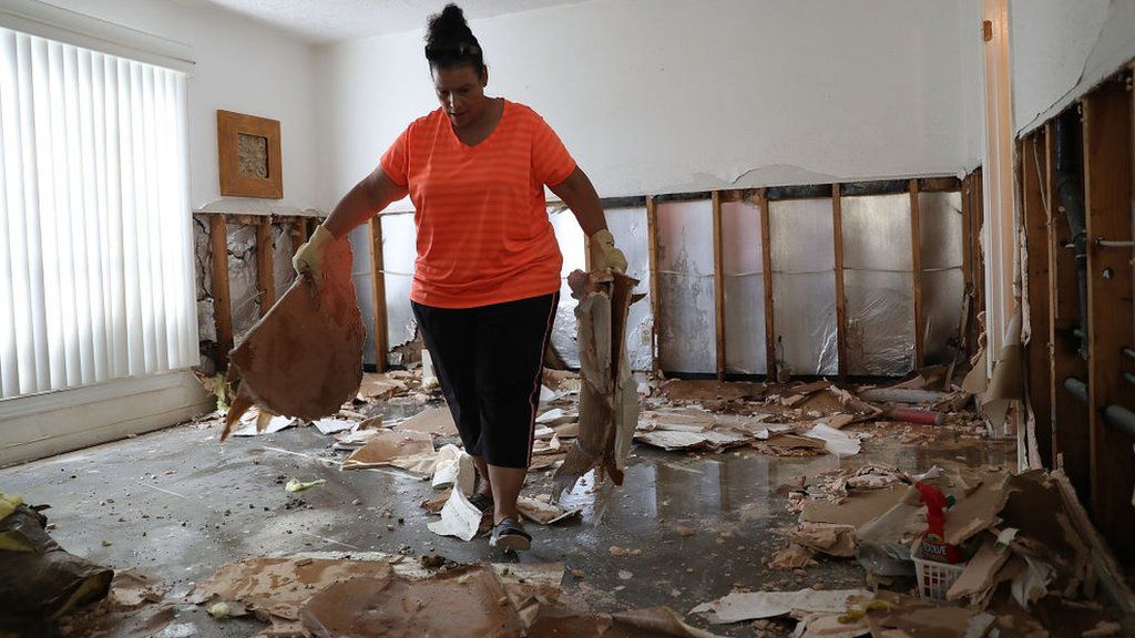 homeowner clears debris