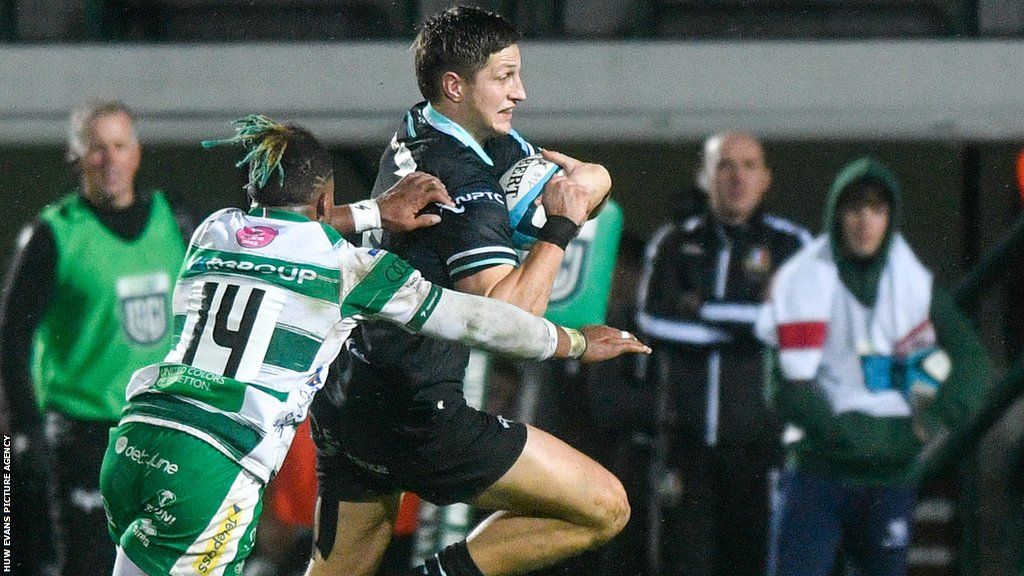 Max Nagy of Ospreys is tackled by Paolo Odogwu of Benetton
