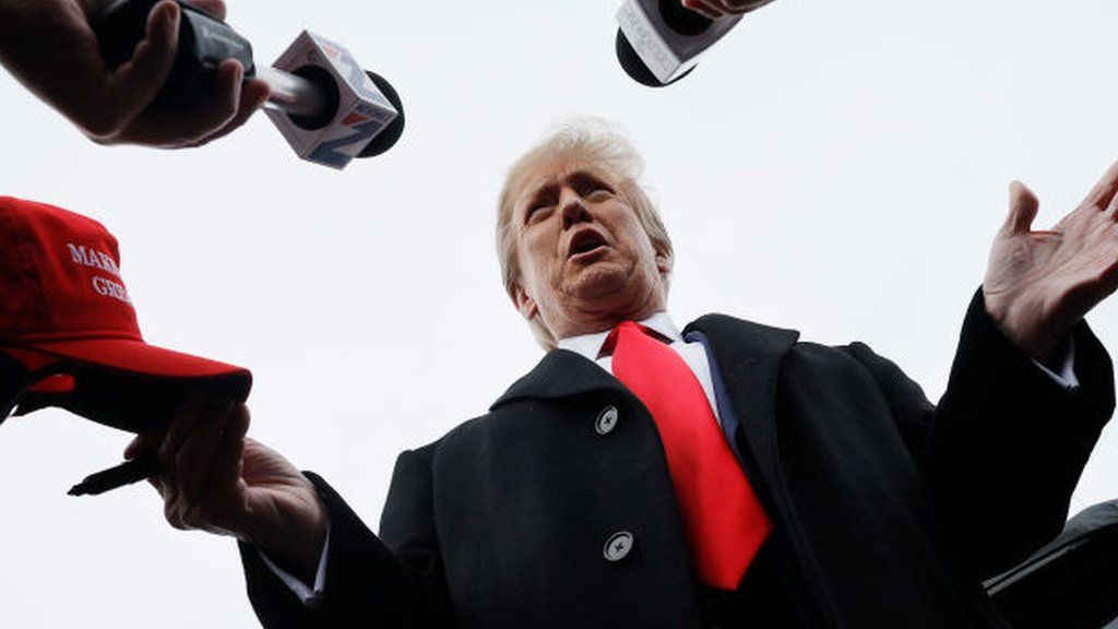 Donald Trump talks to reporters in Londonderry, New Hampshire, on 23 January 2024
