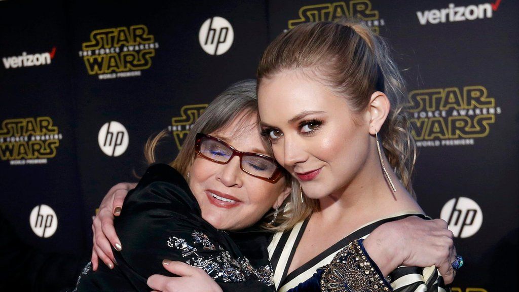 Carrie Fisher (left) and Billie Lourd embrace as they arrive at the premiere of Star Wars: The Force Awakens. Photo: December 2015