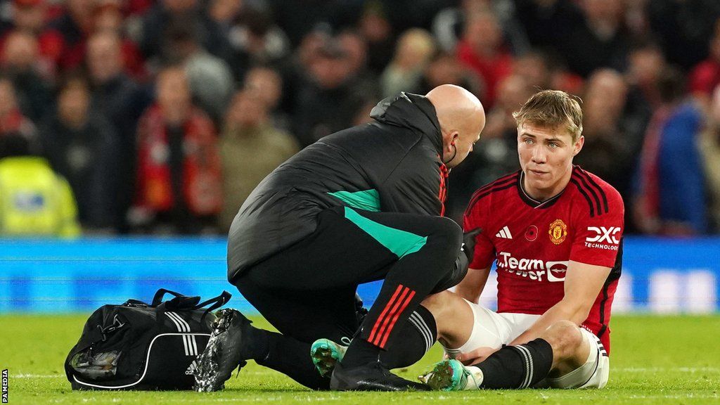 Manchester United striker Rasmus Hojlund receives treatment during his side's win against Luton Town