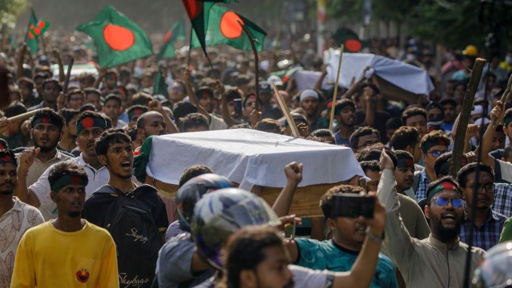 Students join in a coffin rally at the University of Dhaka