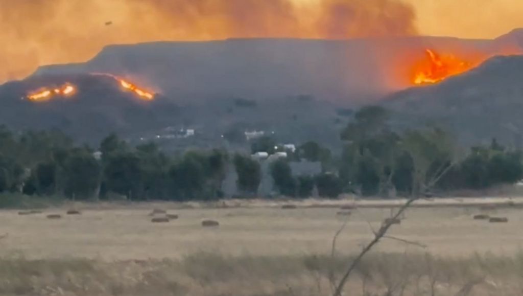 Wildfires burn in the hills on Kos