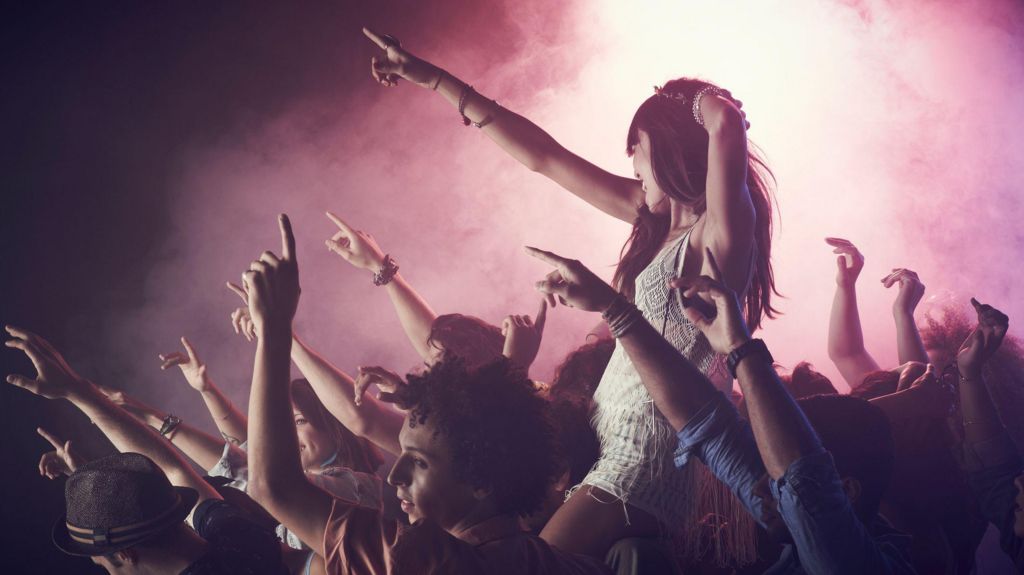 A crowd dancing at a concert