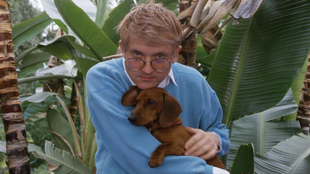 Hockney pictured with one of his beloved dachshunds in 1988