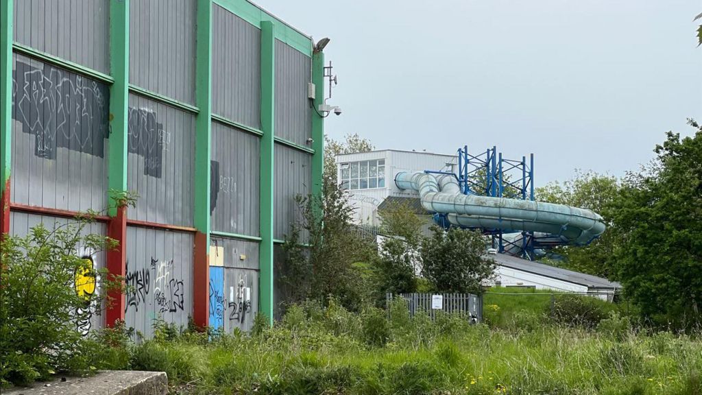 A closed leisure centre with graffiti