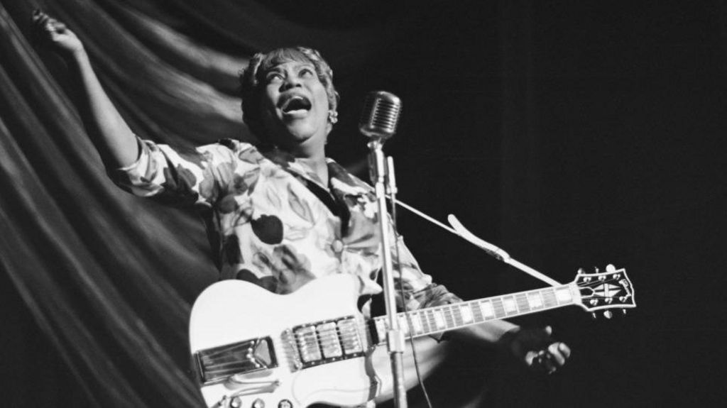 American gospel singer Sister Rosetta Tharpe (1915 - 1973) performs at a Blues and Gospel Caravan tour in the UK, 1964