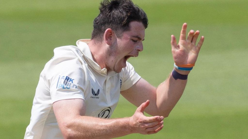 Ethan Bamber celebrates taking a wicket for Middlesex